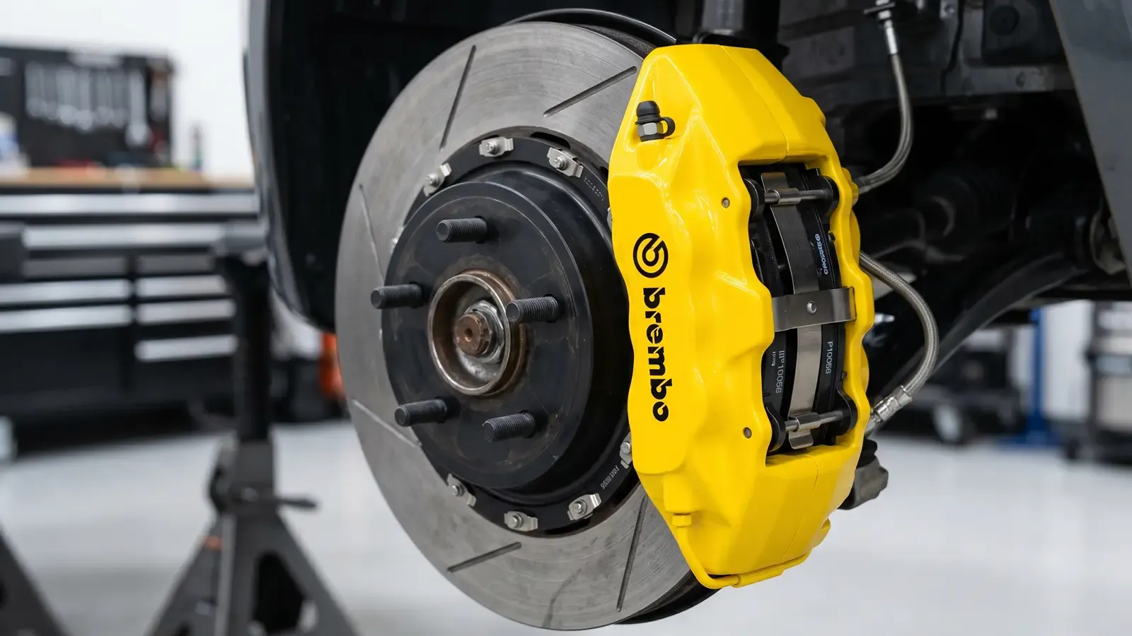Freshly painted brake caliper visible through wheel spokes